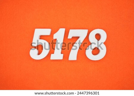 Orange felt is the background. The numbers 5178 are made from white painted wood.