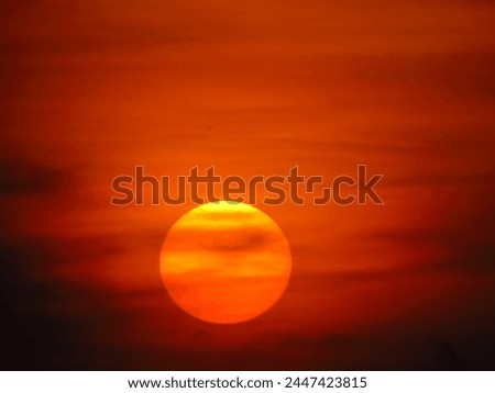 dusky view of the setting sun during sunset in the evening Royalty-Free Stock Photo #2447423815