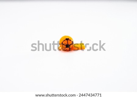 whistle made from plastic with a picture of a ball