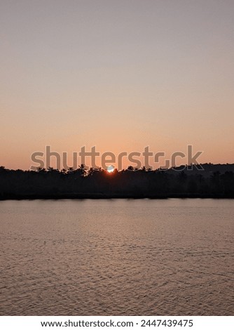 photo of sunrise in a riverside valley 