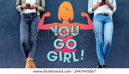 Image o you go girl text and strong woman over two woman using smartphones. female power, feminism and gender equality concept digitally generated image.