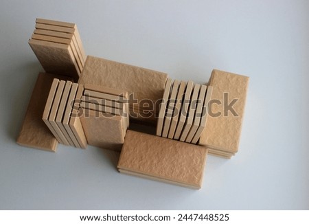 Variety stacks of beige ceramic tiles isolated on white stock photo 
