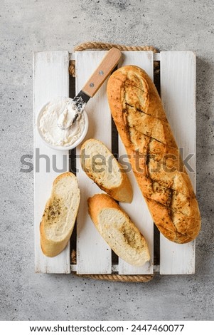 garlic baguette on a gray background. High quality photo