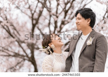 Casual wedding on a spring day when cherry blossoms bloom