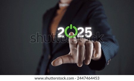 Businessman touching to virtual start button icon with 2025 for start merry Christmas and happy new year concept.