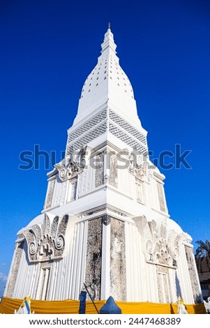 Phra That Tha Uthen Inside contains the relics of the Lord Buddha and the relics of the Arahant. Including Buddha statues and various valuables. that believers put in offerings to the relics Royalty-Free Stock Photo #2447468389