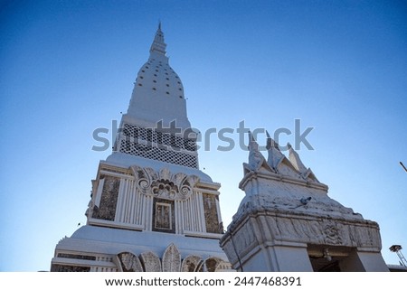 Phra That Tha Uthen Inside contains the relics of the Lord Buddha and the relics of the Arahant. Including Buddha statues and various valuables. that believers put in offerings to the relics Royalty-Free Stock Photo #2447468391