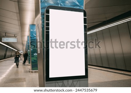 An electronic advertising screen at a metro station. Free space. Outdoor advertising in public transport, metro platform.