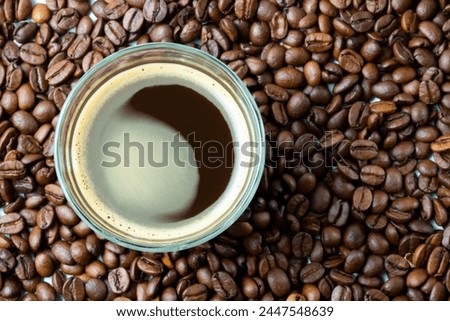 Coffee in a mug and coffee beans