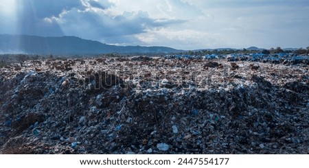 A pile of garbage in a landfill, aerial view from above. Concept of ecology.