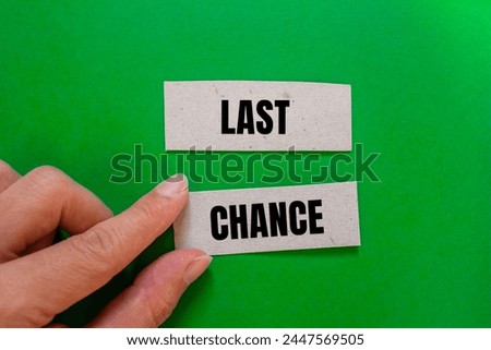 Last chance words written on ripped paper with green background. Conceptual symbol. Copy space.