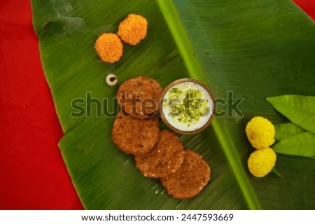 Navratri Upwas Thali  Fasting food platter on banana leaf background Royalty-Free Stock Photo #2447593669