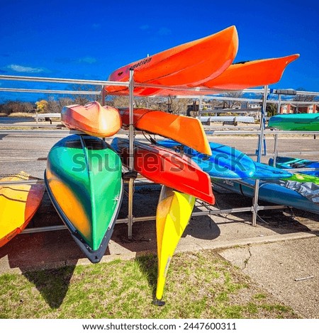 Colorful Kayak Rack, Outdoor Sports, Bay  Royalty-Free Stock Photo #2447600311