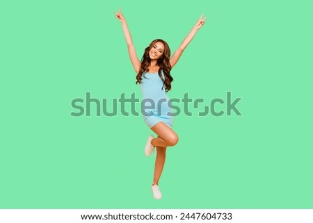 Full length body size photo amazing beautiful her she lady hands arms raised show v-sign slim skinny ideal shape fit wearing blue teal green everyday short dress clothes isolated yellow background Royalty-Free Stock Photo #2447604733