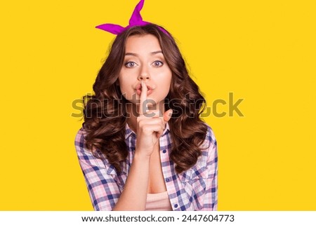 Attractive pretty lovely cute sweet gorgeous lady with her modern hairdo she hold finger forefinger near lips make shh sign gesture isolated on shine violet background in checkered shirt casual wear Royalty-Free Stock Photo #2447604773