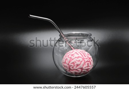 Drinking on brain refreshment glass on black background Royalty-Free Stock Photo #2447605557