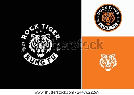 A bengal tiger face head with fangs and kung fu chinese lettering for Kungfu Club Martial Clan logo design Royalty-Free Stock Photo #2447622269