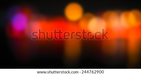 cityscape at night with lights blurred into bokeh circles background.