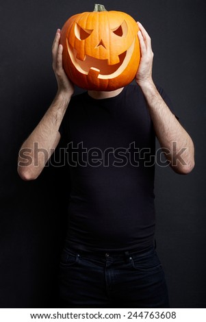 Halloween pumpkin on man head, joking, clipping path included