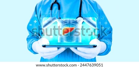Doctor projects the human liver on his tablet, analyzes and studies the liver, for the treatment of health problems. Hepatologist. Examination for the detection of gastroenterological abnormalities. l Royalty-Free Stock Photo #2447639051