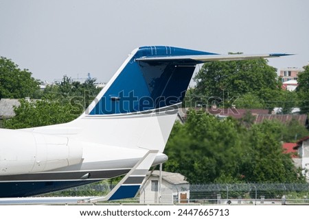 Private VIP aircraft's vertical stabilizer and winglet close-up Royalty-Free Stock Photo #2447665713