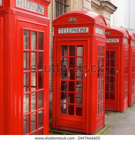 Row of red telephone booths design by Sir Giles Gilbert Scott, near Covent Garden, London, England, United Kingdom, Europe 