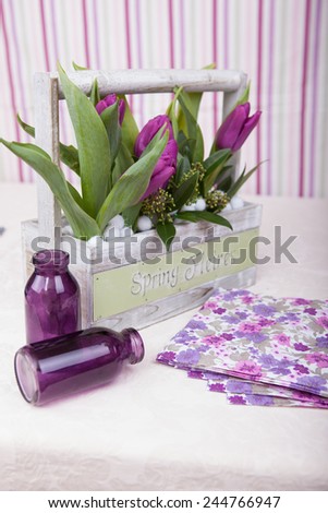 Bouquet of purple tulips on a table in interior