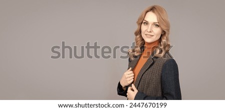 confident blonde woman in checkered english jacket, businesswoman. Woman portrait, isolated header banner with copy space.