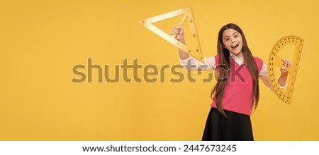 geometric shapes. measure the angle. child with triangle. amazed teen girl hold protractor ruler. Banner of schoolgirl student. School child pupil portrait with copy space.