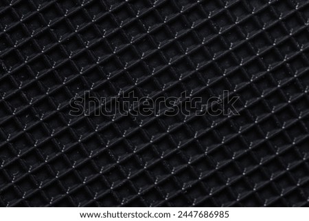 Black carbon fiber background. Closeup of carbon fiber texture