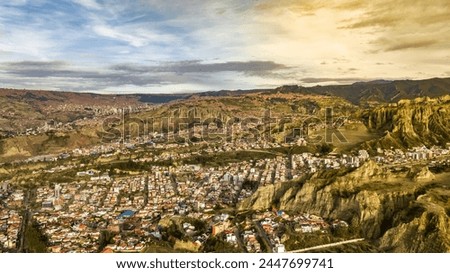 La Paz, Bolivia, aerial view flying over the dense, urban cityscape. San Miguel, southern distric. South America Royalty-Free Stock Photo #2447699741
