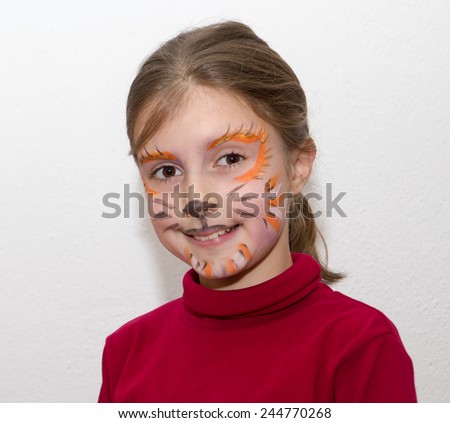 Cute little girl with face painted