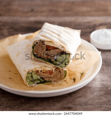 Homemade pork wrap with vegetables and cheese