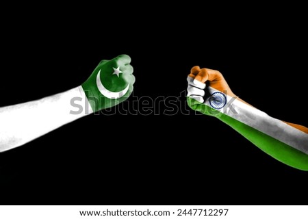INDIA vs PAKISTAN, India vs Pakistan flag. Fists with flags. The flags of India and Pakistan are drawn on two fists. Concept of trade disputes between India and Pakistan