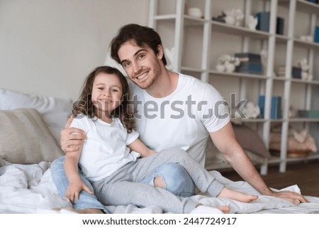 Cheerful happy young caucasian father spending time with his little small daughter together, celebrating father`s day. I love you, dad! Family holiday Royalty-Free Stock Photo #2447724917