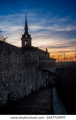 Collegiate church tower of San Pedro in Lerma, Burgos, Spain. Sunset picture.