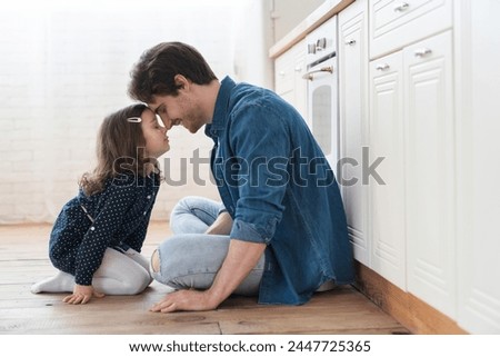 Loving cheerful family, young father and little daughter spending time together, playing on the floor. Happy father`s day! I love you, dad! Parenthood and fatherhood concept Royalty-Free Stock Photo #2447725365