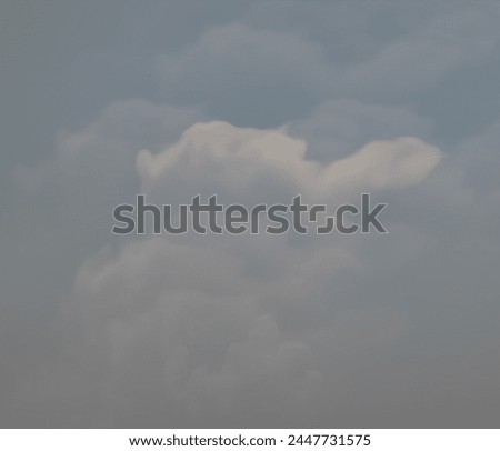 Modern photography of creatively captured soft white clouds in a modern blue sky.  Vintage feel.
