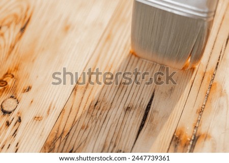 Impregnation of wooden boards with oil.Protecting the wooden surface from damage.Impregnation of a wooden table with protective oil. Royalty-Free Stock Photo #2447739361