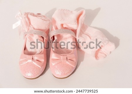 little girl's pink sparkly make belief princess shoes, bows and glitter for little princess on light background, happy childhood, Stylish pink outfit for party
