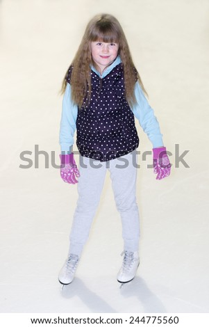 little girl without a hat with her hair in ice skating worth