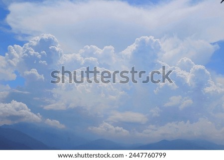 In the mesmerizing blue sky photo, wispy clouds drift across a serene cerulean canvas, evoking feelings of freedom and wonder. It's a snapshot of tranquility, urging us to pause and appreciate nature