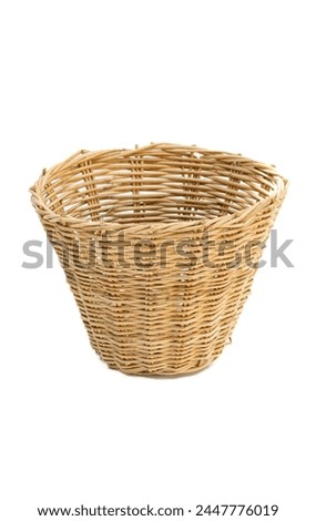 Brown bamboo woven basket Weaving work from natural materials for holding things. Bamboo basket on white background. Royalty-Free Stock Photo #2447776019