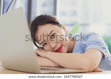 Photo of young Asian businesswoman working