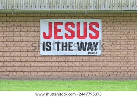 Jesus is the way sign on a brick wall