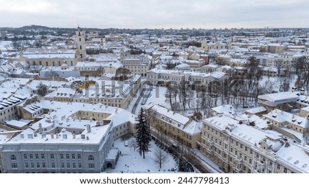 Drone photography of city covered by snow during winter cloudy day