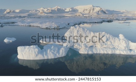 Antarctica Polar Iceberg Coast Aerial Drone View. Snow Covered Arctic Ocean Shore Landscape Panoramic Overview. North Nature Seascape Copter Royalty-Free Stock Photo #2447815153