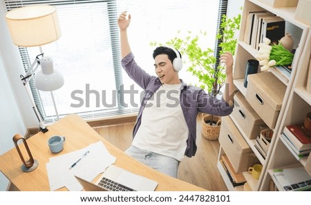 Photo of young Asian businessman working