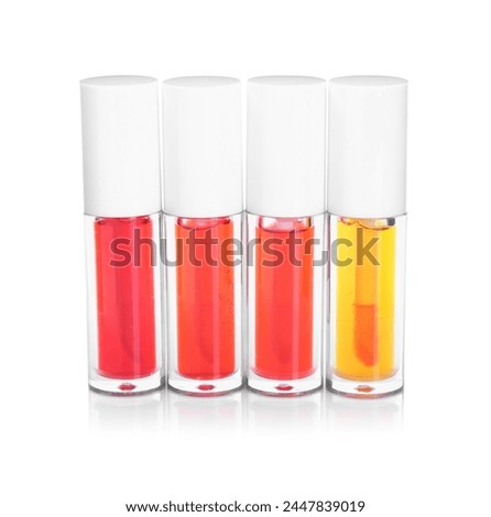 Many bright lip glosses isolated on white