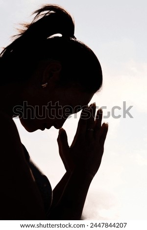 woman practicing yoga in pray position